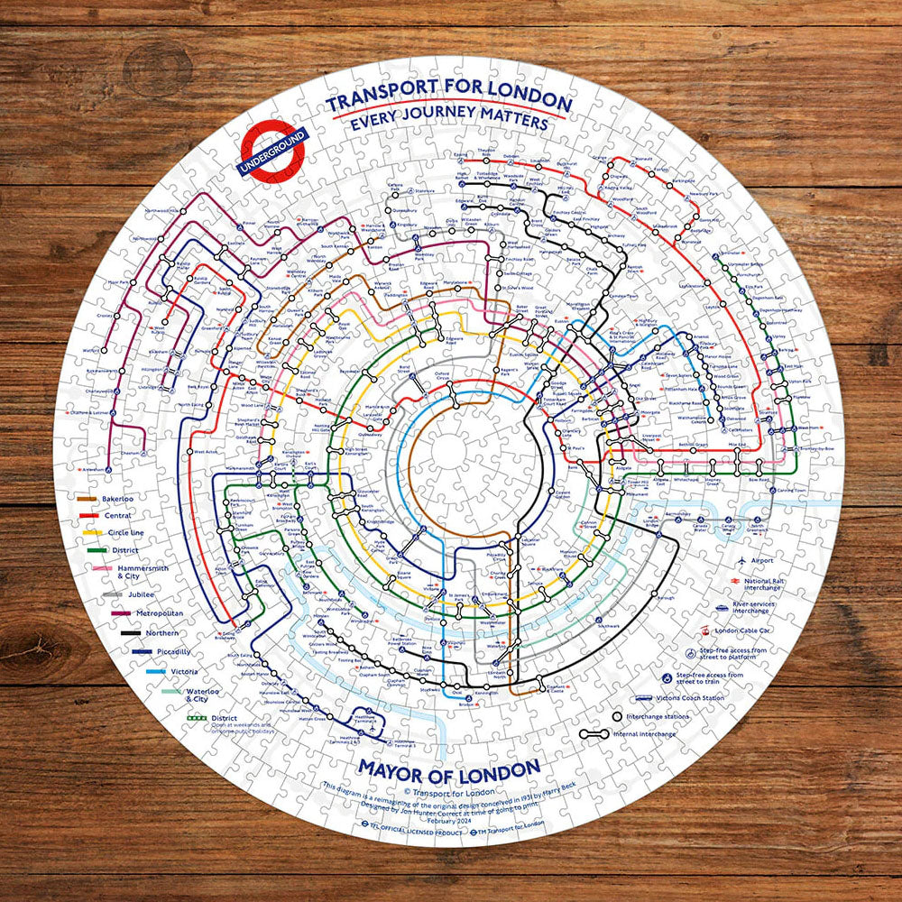 Gibsons TFL Circular Tube Map 500pc Puzzle assembled on wooden desk