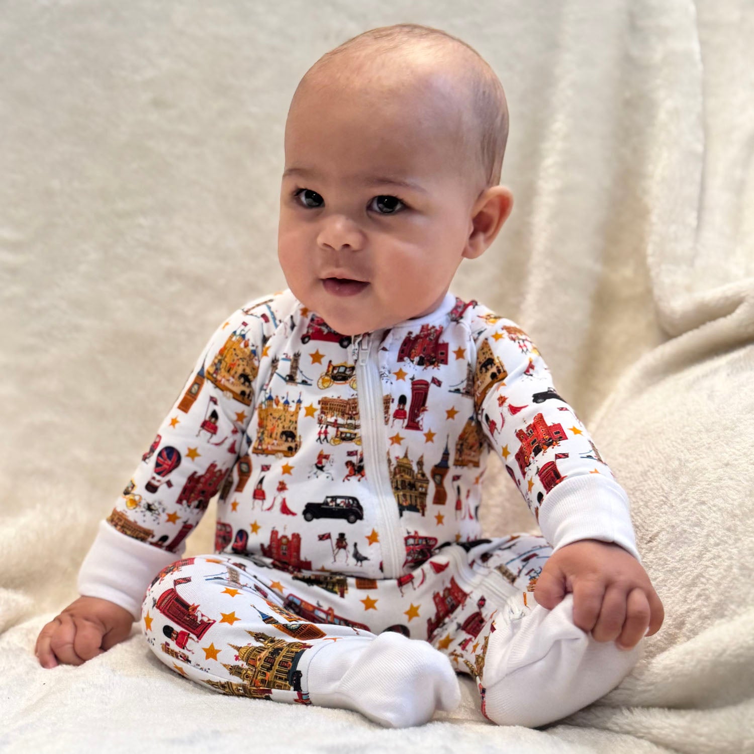 Baby wearing Peckish Goose London Organic Baby Sleepsuit
