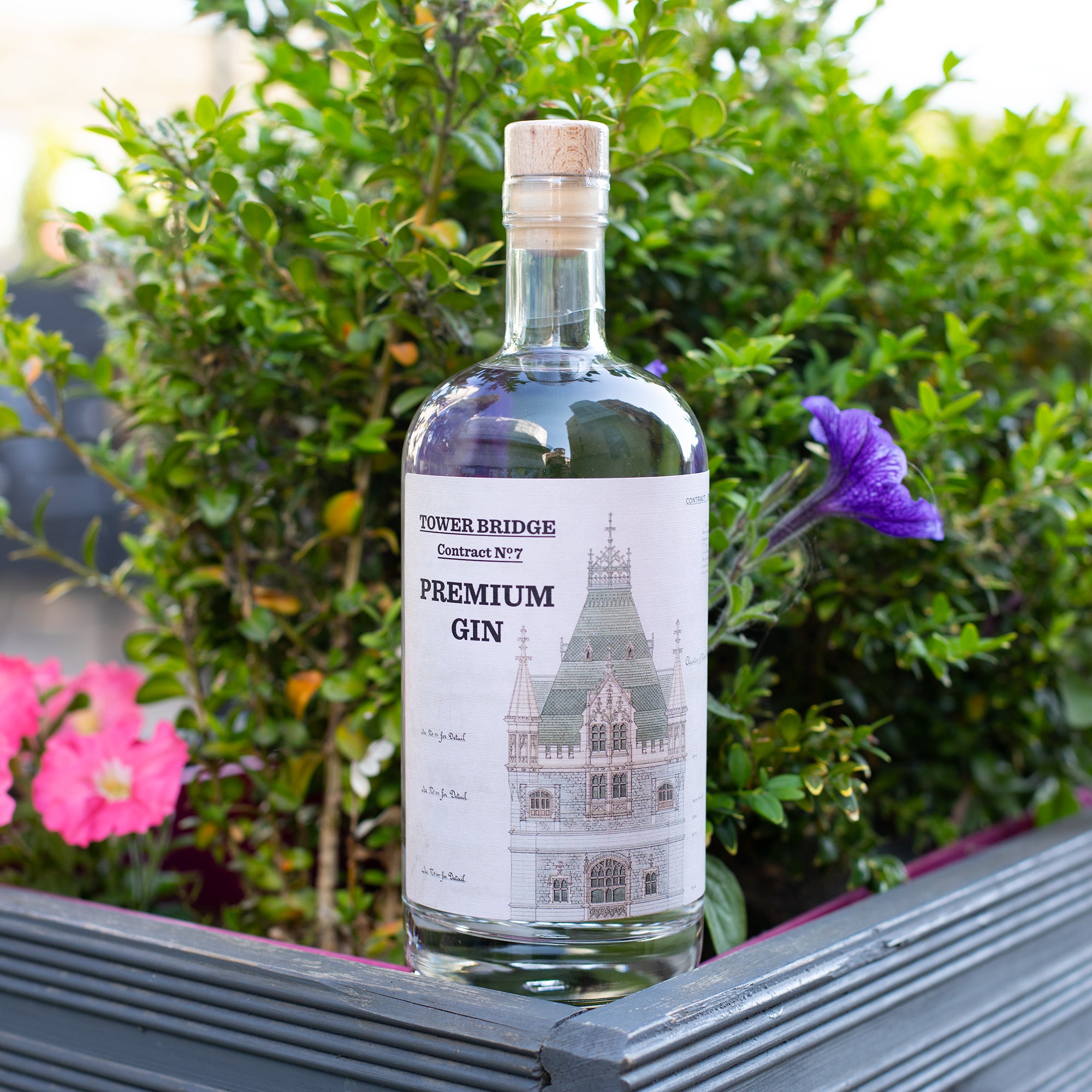 Tower Bridge Contract No. 7 Premium Gin in front of flowers