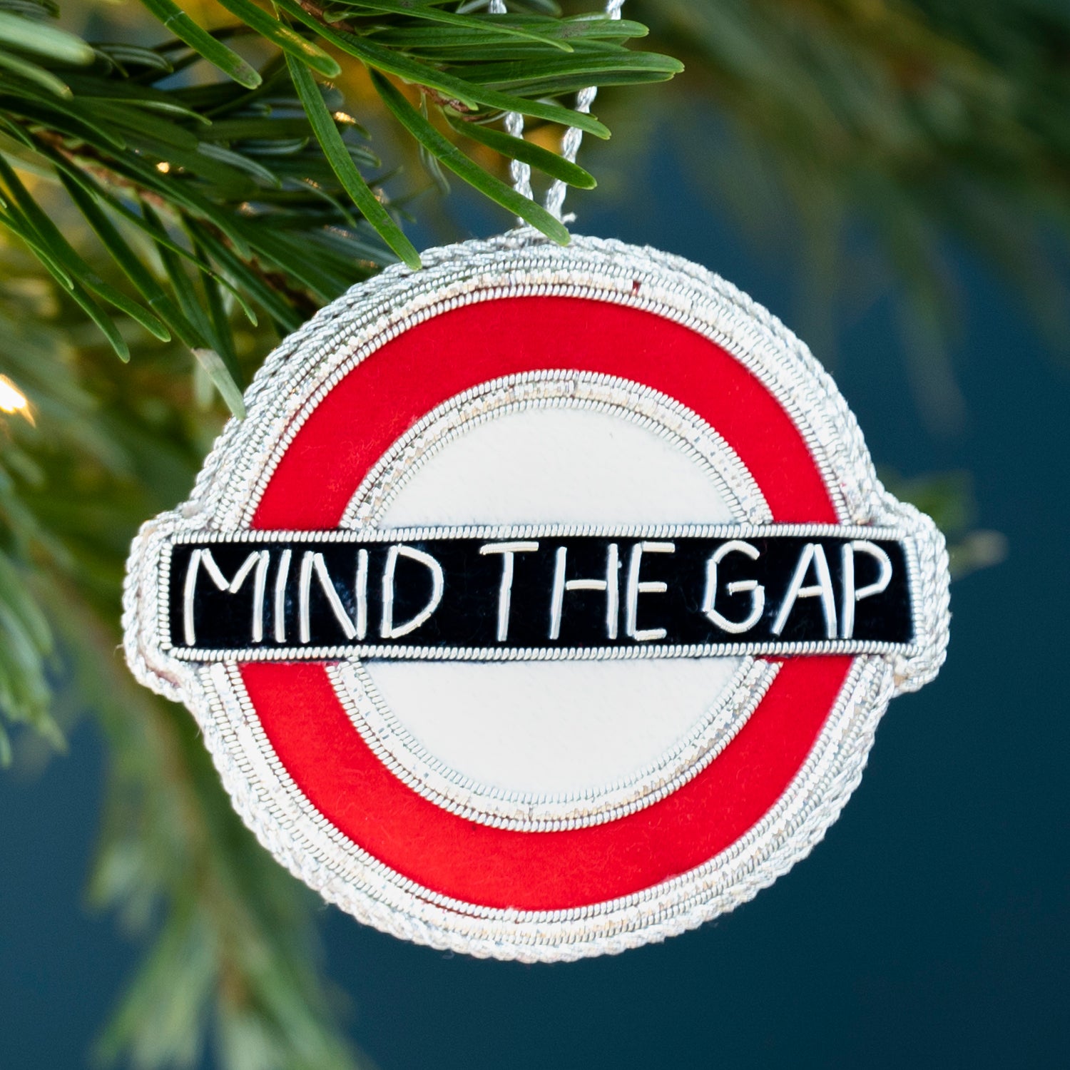 Stitched Mind The Gap decoration hanging from Christmas tree